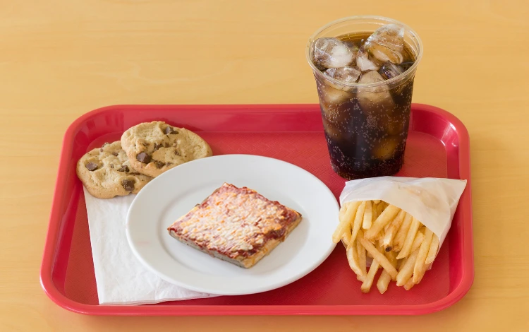Pizza, chips, cookies and a fizzy drink