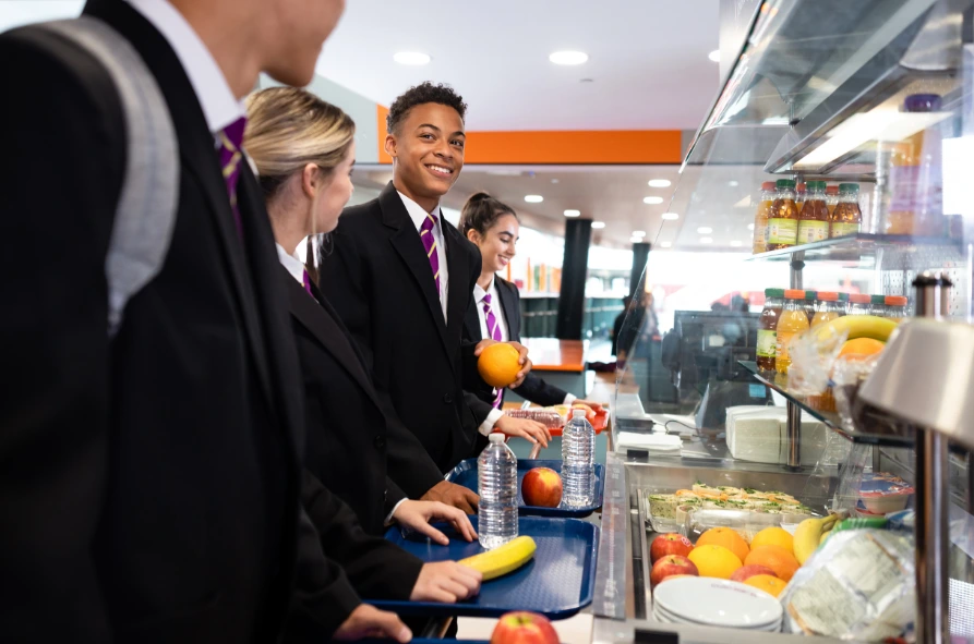 Students buying lunch in the school cafeteria