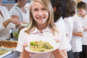Girl holding a school dinner