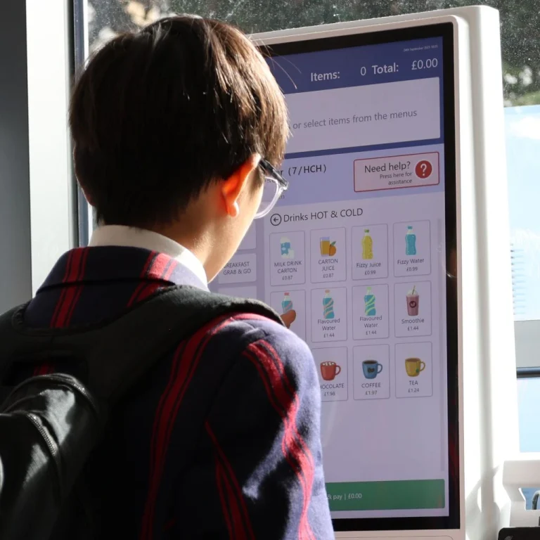 Student views prices on a Self-Serve Kiosk