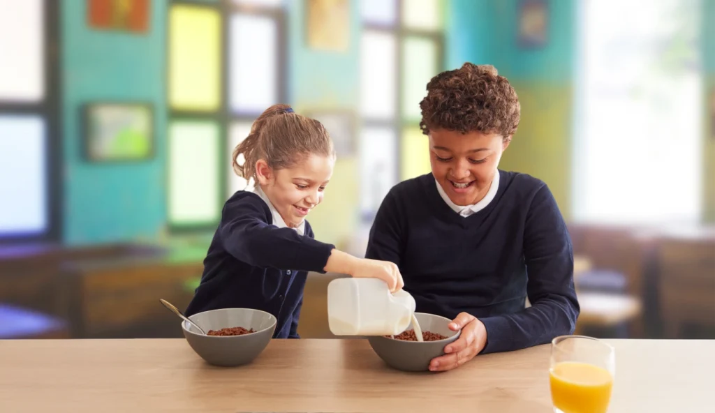 Children eating cereal at breakfast club