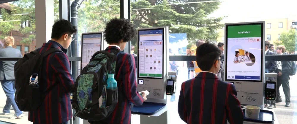 3 Tiffin School students buying lunch with Self-Serve Kiosks