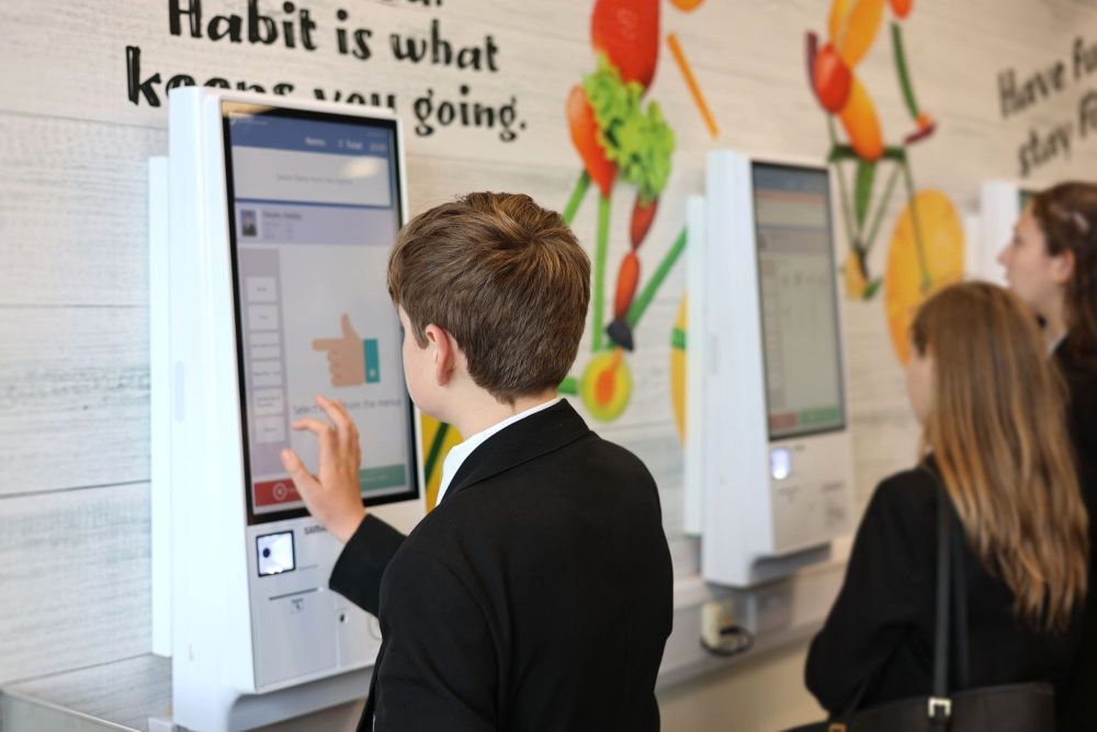 Students use Self-Serve Kiosks to order school meals