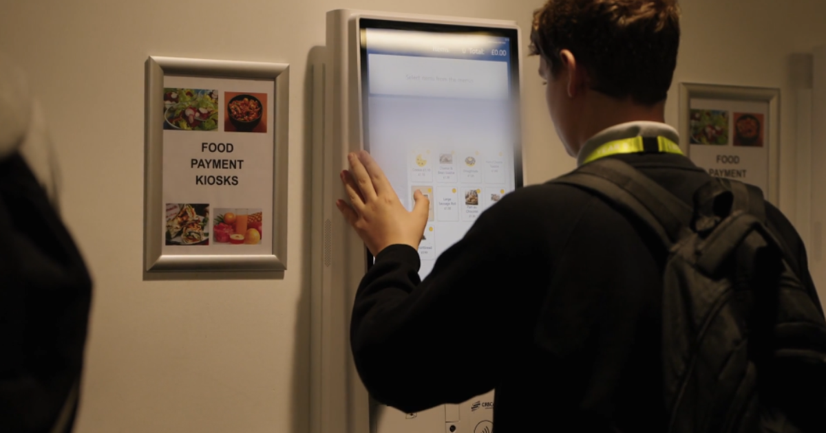 Student using self-serve kiosk